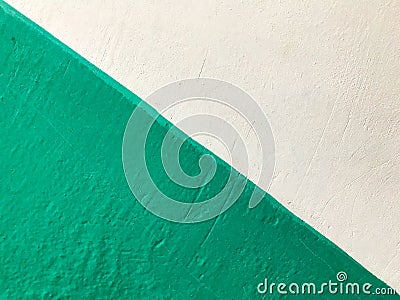 A diagonal line on the wall that divides 2 colors. Stock Photo