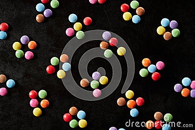 Diagonal rows of grouped colorful chocolate candy Stock Photo