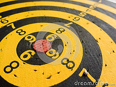 Diagonal view of an used dartboard Stock Photo