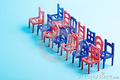 Diagonally installed chairs in two rows, blue and red color Stock Photo