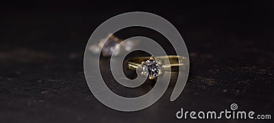 Diamond ring is a wedding ring luxurious and expensive laid on the ground Stock Photo