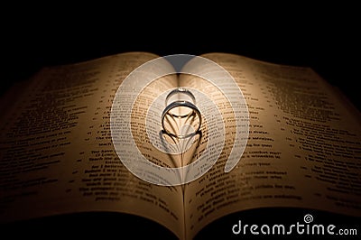 Diamond Wedding Ring On A Bible Stock Photo