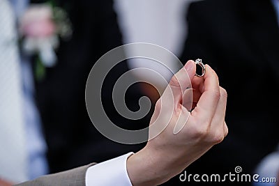 Diamonds ring in hand groom Stock Photo