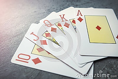 Diamonds royal flush playing cards poker combination on grey background Stock Photo