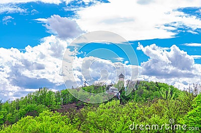 Diana Observation Tower Rozhledna Diana and funicular on hill above Slavkov Forest with green trees and Karlovy Vary Stock Photo