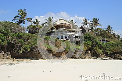 Hotel on the shores of the Indian Ocean surrounded by palm trees. Kenya, Africa Stock Photo