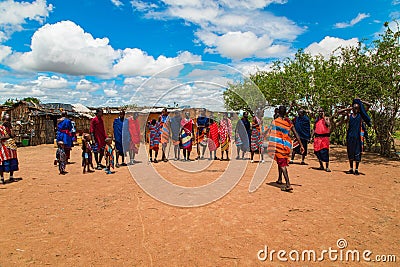Massai men, wearing traditional blankets, overlooks Serengetti in Tanzania and Kenya in traditional massai village Editorial Stock Photo