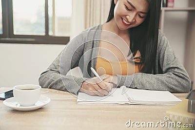 On diary and Calendar page,Female hand plan event Stock Photo