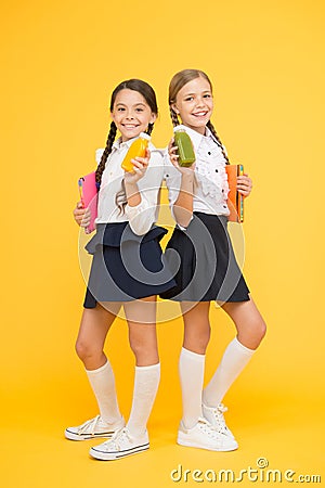 Diary and dairy. lunch time. small girls with book. read and write. happy girls study with notepad at lesson. back to Stock Photo