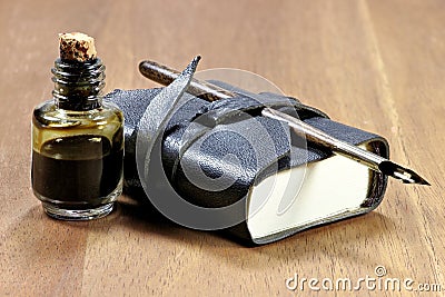 Diary with dib pen and inkwell Stock Photo