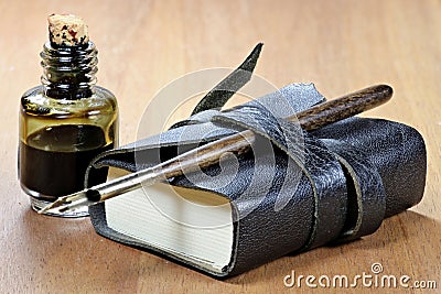 Diary with dib pen and inkwell Stock Photo