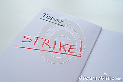 Diary page with text `today strike` Stock Photo