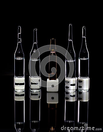 Dice with ampoules on a black background Stock Photo