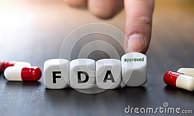 Dice form the expression FDA (Food and Drug Administration) approved. Stock Photo