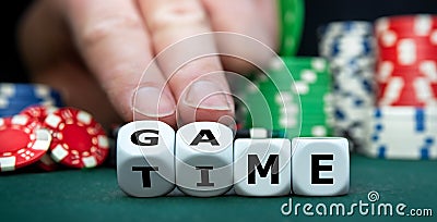 Dice form the expression 'game time. Stock Photo