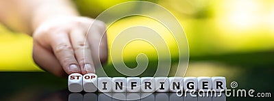 Dice form the expression `stop infringer`. Stock Photo