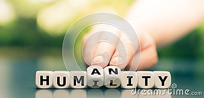 Dice form the words `humility` and `humanity`. Stock Photo