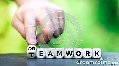 Dice form the words teamwork and dream work. Stock Photo