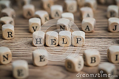 Dice forming the word HELP Stock Photo