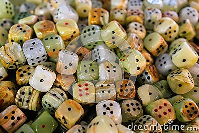 Dice made of natural stone. Background with selective focus and copy space Stock Photo