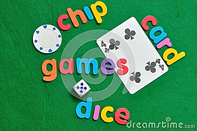 A dice, poker chip and card with words Stock Photo