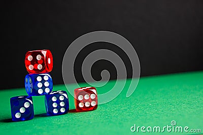 dice red and blue color green and black background Stock Photo