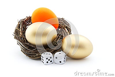 Dice and red nest egg reflect investment risk Stock Photo