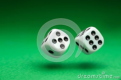 Dice thrown over the green table. Playing dice close up Stock Photo