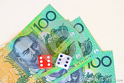 Australian hundred dollar notes and dice. Stock Photo