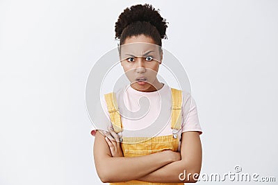 He did what. portrait of shocked displeased and confused good-looking african girlfriend with hands crossed on chest Stock Photo