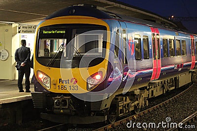 Diesel multiple unit train in Carnforth in evening Editorial Stock Photo