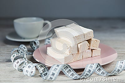 Diet dessert with measure tape and cup of tea Stock Photo