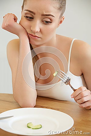 Diet. Dieting concept. Healthy Food. Beautiful Young Woman eats Stock Photo