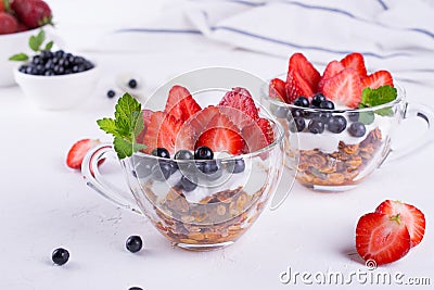 Diet healthy dessert with yogurt, granola and fresh berries. Stock Photo