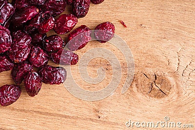Diet healthy food. Border of dried cranberries on wooden background Stock Photo