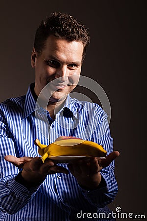 Diet nutrition. Happy young man holding fruits. Stock Photo