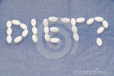 Diet word written with diet nutrition capsules Stock Photo