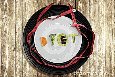 Diet text with measuring tape above table Stock Photo