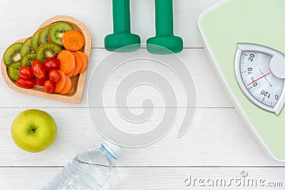 Diet and weight loss for healthy care with weight scale and fitness equipment,fresh water and fruit healthy, Stock Photo