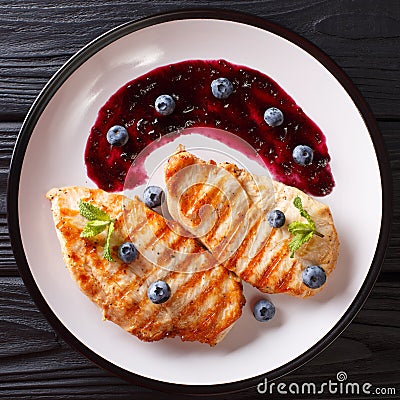 Dietary delicious food: Grilled chicken fillet with blueberry sa Stock Photo