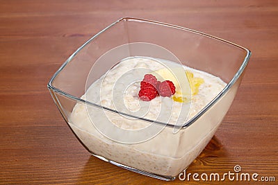 Dietary Rice porridge with raspberry Stock Photo