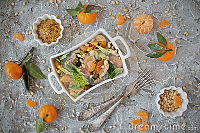 Dietary spinach salad and Mandarin oranges with dressing of mustard and pine nuts Stock Photo