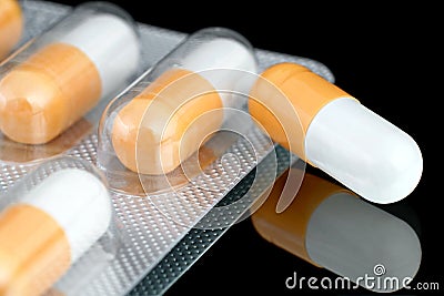 Dietary supplement in gelatin capsules. Stock Photo