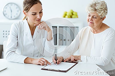 Dietician and diabetic discussing diet Stock Photo