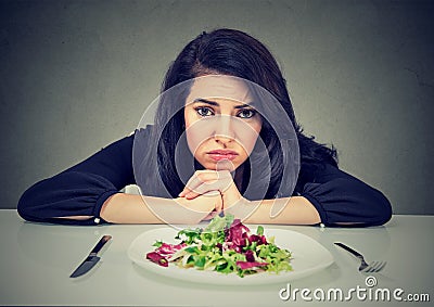 Dieting habits changes. Woman hates vegetarian diet Stock Photo