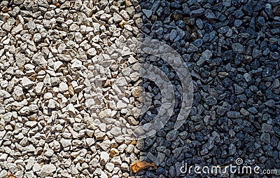 Difference concept. half gravel is in sun and half is shadow. Gravel pattern Stock Photo