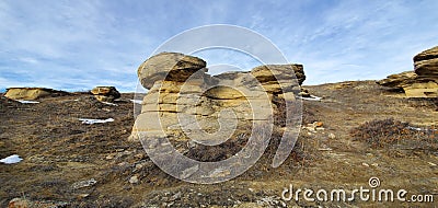 The difference in the sediment at the top of the Hoodoos really holds them together along with giving a nice change in color. Stock Photo