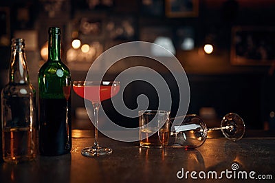 Different alcohol beverages on counter in bar Stock Photo