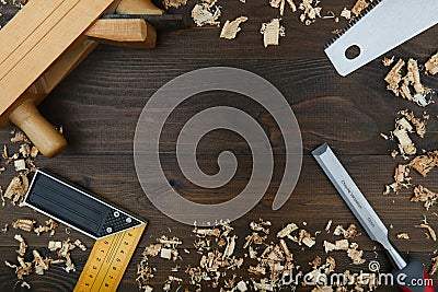 Carpentry tools on dark wood background Stock Photo