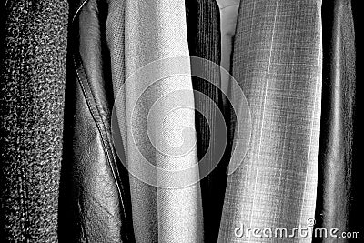 Different clothes placed in the wardrobe. Black and white. Good texture Stock Photo